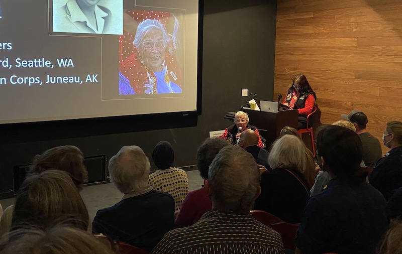 A real "rosie" speaking in front of a group