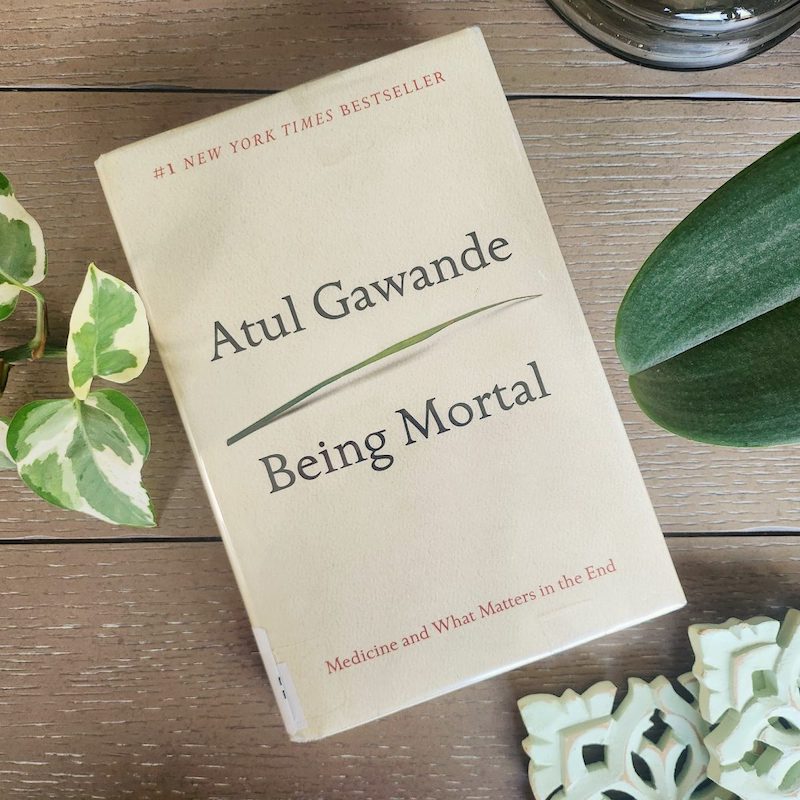 Book cover of "Being Mortal" on a tabletop