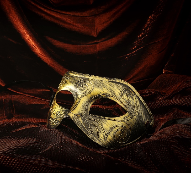 An old-fashioned gold face mask