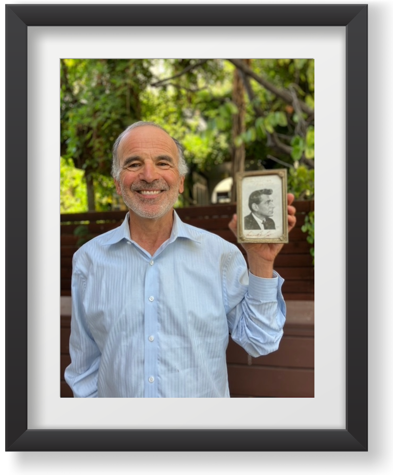 Benjamin Simon holding an autographed photo of Leonard Bernstein