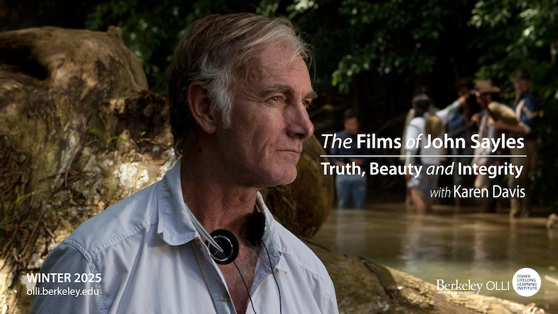 Photo of John Sayles on a film shoot staring off in distance 