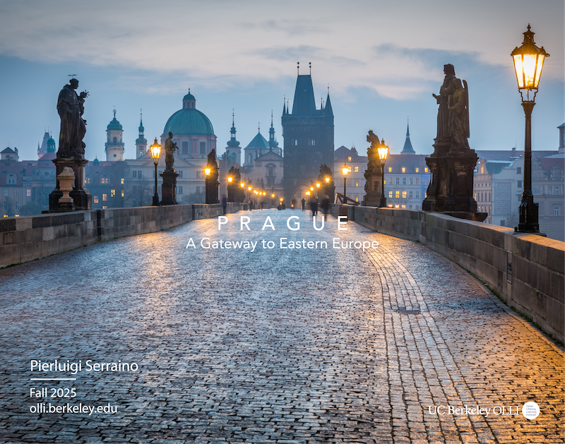 Stunning winter view across a dusk-skyed, glowingly lit bridge in Prague
