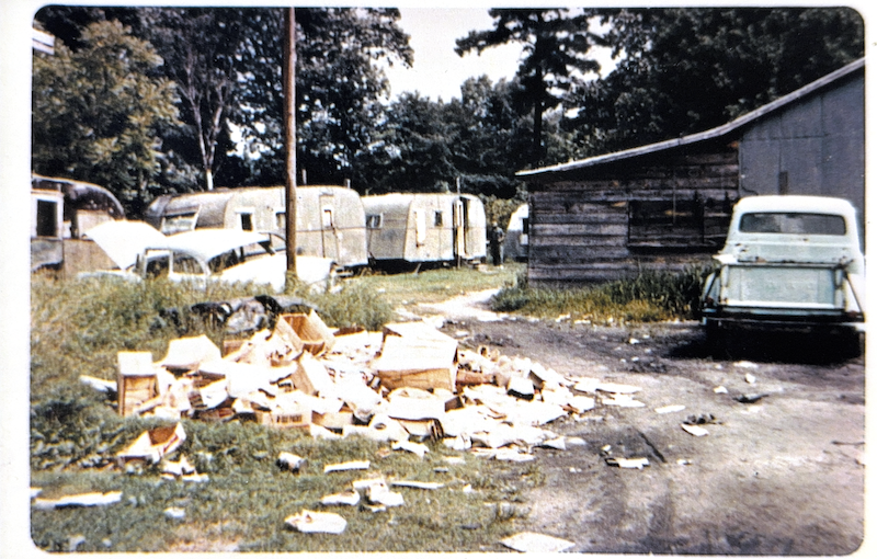 Garbage piled outside of homes